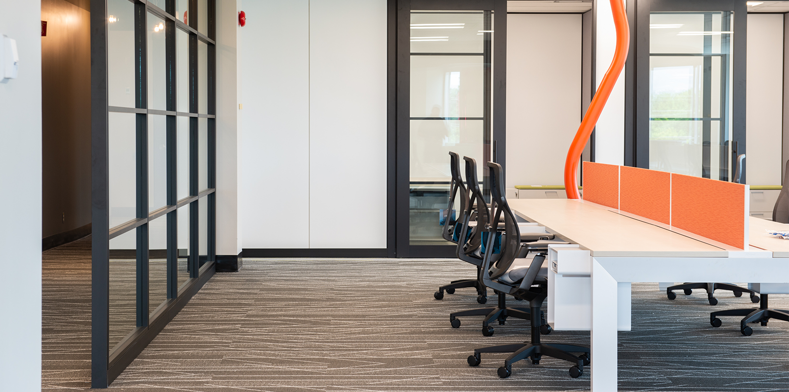 Desk with multiple chairs for collaboration