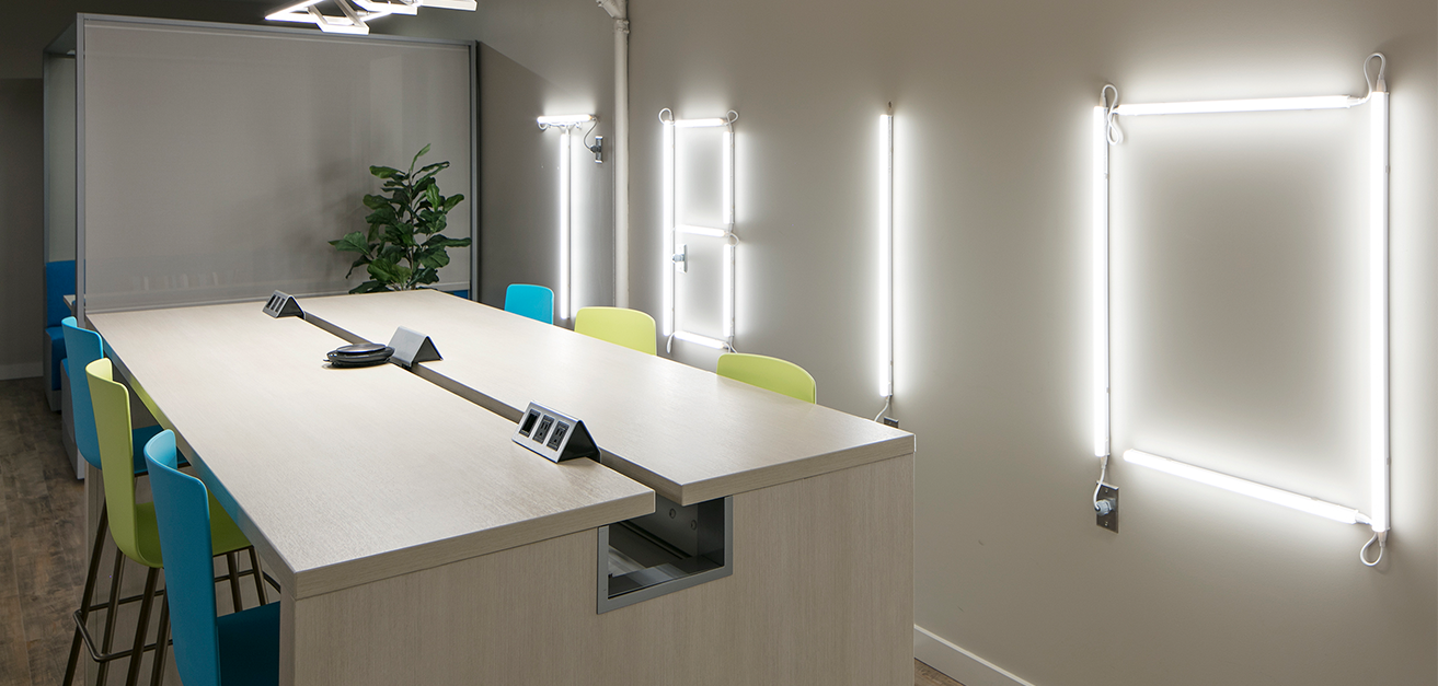 Meeting desk with accent neon lighting on back wall